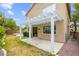 Spacious backyard featuring a covered patio area, perfect for outdoor entertaining at 10393 Trailing Dalea Ave, Las Vegas, NV 89135