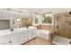 Bright bathroom with a soaking tub, double vanity, and a glass-enclosed shower for a relaxing experience at 10393 Trailing Dalea Ave, Las Vegas, NV 89135