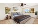 Comfortable bedroom with a soft rug, neutral tones, and large windows providing ample natural light at 10393 Trailing Dalea Ave, Las Vegas, NV 89135