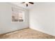 Minimalist bedroom with a large window and tile flooring at 10393 Trailing Dalea Ave, Las Vegas, NV 89135