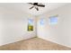 Bright bedroom features neutral walls, tile flooring and two windows letting in natural light at 10393 Trailing Dalea Ave, Las Vegas, NV 89135