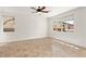 A sun-filled bedroom that features tile floors, and a ceiling fan at 10393 Trailing Dalea Ave, Las Vegas, NV 89135