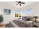 Well-lit bedroom with soft rug, neutral tones, and multiple windows providing ample natural light at 10393 Trailing Dalea Ave, Las Vegas, NV 89135