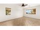 Spacious bedroom with tile floors and ample natural light from multiple windows at 10393 Trailing Dalea Ave, Las Vegas, NV 89135