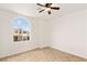 Bedroom with tile floor features a large window that lets in natural light at 10393 Trailing Dalea Ave, Las Vegas, NV 89135