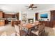 Open concept home with a dining area, fireplace, and a view into the kitchen at 10393 Trailing Dalea Ave, Las Vegas, NV 89135