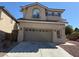 Charming two-story home with a two-car garage and well-maintained landscaping at 10393 Trailing Dalea Ave, Las Vegas, NV 89135