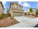 Beautiful home showcasing a well-maintained lawn, neutral color palette, and attached garage at 10393 Trailing Dalea Ave, Las Vegas, NV 89135