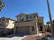 Charming two-story home with a two car garage and drought-resistant landscaping at 10393 Trailing Dalea Ave, Las Vegas, NV 89135