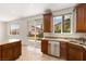 Kitchen featuring a center island, stainless steel appliances, and access to the backyard at 10393 Trailing Dalea Ave, Las Vegas, NV 89135