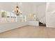 Bright and airy living room with beautiful floors, high ceilings, and a chandelier at 10393 Trailing Dalea Ave, Las Vegas, NV 89135