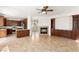 Open-concept living and kitchen area with a fireplace and modern appliances at 10393 Trailing Dalea Ave, Las Vegas, NV 89135