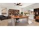 Bright home office featuring built-in bookshelves and a large desk perfect for working at home at 10393 Trailing Dalea Ave, Las Vegas, NV 89135