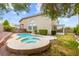 Backyard pool and spa with lush landscaping, perfect for outdoor entertaining and relaxation at 10393 Trailing Dalea Ave, Las Vegas, NV 89135