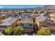 The aerial shot highlights a charming home in a picturesque neighborhood, complete with mountain views at 10433 Mount Washington Ave, Las Vegas, NV 89166