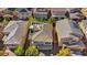 An aerial view reveals a beautiful home with a rooftop deck nestled among other well-kept residences at 10433 Mount Washington Ave, Las Vegas, NV 89166