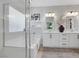 Bright bathroom with double vanity, tub, glass shower, and modern fixtures at 10433 Mount Washington Ave, Las Vegas, NV 89166