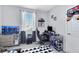 Gamer themed bedroom with modern desk, TV and sporty decor at 10433 Mount Washington Ave, Las Vegas, NV 89166