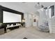 Spacious entertainment room with projector screen, comfy seating, and modern finishes at 10433 Mount Washington Ave, Las Vegas, NV 89166