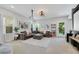 Cozy entertainment room with large sectional, projection screen, and comfortable seating at 10433 Mount Washington Ave, Las Vegas, NV 89166