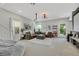 Bright and airy entertainment room with large sectional sofa and backyard access at 10433 Mount Washington Ave, Las Vegas, NV 89166