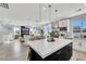 Spacious kitchen with a large island, stainless steel appliances, and a view to the living area at 10433 Mount Washington Ave, Las Vegas, NV 89166
