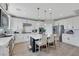 Gourmet kitchen boasts a center island, pendant lighting, and stainless steel appliances at 10433 Mount Washington Ave, Las Vegas, NV 89166