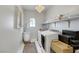 Well-equipped laundry room with modern washer, dryer, and ample storage at 10433 Mount Washington Ave, Las Vegas, NV 89166