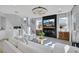 Cozy living room featuring a comfortable white sofa, fireplace, and stylish decor at 10433 Mount Washington Ave, Las Vegas, NV 89166