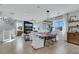 Bright and airy living room with wood floors, stylish decor, and ample natural light at 10433 Mount Washington Ave, Las Vegas, NV 89166
