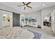 Bright main bedroom with a sliding barn door, modern decor, and spacious layout at 10433 Mount Washington Ave, Las Vegas, NV 89166