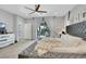 Inviting main bedroom with plush bed, backyard access, and ample natural light at 10433 Mount Washington Ave, Las Vegas, NV 89166