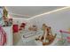 Inviting ' playroom with a play mat, rocking horse, and cozy seating at 10433 Mount Washington Ave, Las Vegas, NV 89166