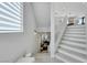 Staircase leading to the upper level with natural light and modern design at 10433 Mount Washington Ave, Las Vegas, NV 89166