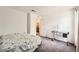 Bright bedroom with plush carpet and desk featuring a lamp at 10663 Sariah Skye Ave, Las Vegas, NV 89166