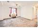 Spacious bonus room with plush carpet, bench, and window at 10663 Sariah Skye Ave, Las Vegas, NV 89166