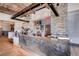 Modern cafe area with stone accents, coffee machines, display cases, and stylish countertops at 10663 Sariah Skye Ave, Las Vegas, NV 89166