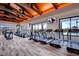 Fitness center with treadmills, elliptical machines, and large windows overlooking the community at 10663 Sariah Skye Ave, Las Vegas, NV 89166