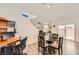 Open-concept floor plan with a dining table, a view into the living area, and sliding glass doors at 10663 Sariah Skye Ave, Las Vegas, NV 89166