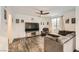 Cozy living room featuring a comfortable sofa, a ceiling fan, and a large television set at 10663 Sariah Skye Ave, Las Vegas, NV 89166