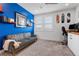 Vibrant bedroom featuring a comfortable couch, desk area, and playful decor at 11315 Gravitation Dr, Las Vegas, NV 89135