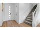 Bright foyer with modern front door and staircase at 11315 Gravitation Dr, Las Vegas, NV 89135