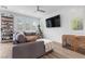 Cozy living room featuring bright natural light, modern decor, and a ceiling fan at 11315 Gravitation Dr, Las Vegas, NV 89135