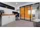 Functional office space with modern decor, sliding doors, and ample storage at 11315 Gravitation Dr, Las Vegas, NV 89135