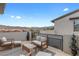 An outdoor patio with mountain views, stylish seating, and modern decor at 11315 Gravitation Dr, Las Vegas, NV 89135