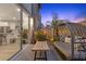 Private patio space with comfortable seating, tropical plants, and modern pavers at 11315 Gravitation Dr, Las Vegas, NV 89135
