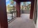 Large balcony with metal railing and sliding glass door access at 15 E Agate Ave # 202, Las Vegas, NV 89123