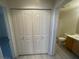 Bathroom featuring a shower-tub combo, a toilet, and a vanity with a sink, and a large closet at 15 E Agate Ave # 202, Las Vegas, NV 89123