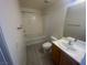 Bathroom featuring a shower-tub combo, a toilet, and a vanity with a sink at 15 E Agate Ave # 202, Las Vegas, NV 89123