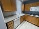 Kitchen features modern appliances, wooden cabinets, and ample counter space for cooking at 15 E Agate Ave # 202, Las Vegas, NV 89123